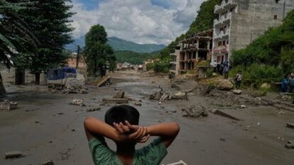 A boy looks at the devastation caused by flash flooding along the Trishuli River in Nepal’s Nuwakot district, Wednesday, Aug. 26, 2026. A boy looks at the devastation caused by flash flooding along the Trishuli River in Nepal’s Nuwakot district, Wednesday, Aug. 26, 2026.