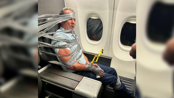 The unruly passenger was arrested after the American Airlines flight was diverted to Baltimore.