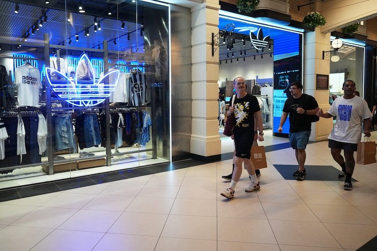 Crew members of the USS Abraham Lincoln walk at a shopping mall in Pattaya, Thailand.