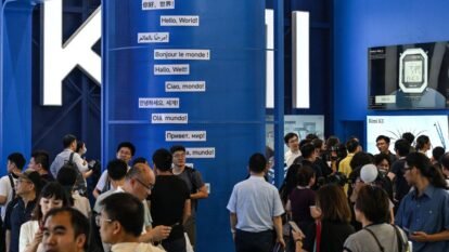 People visit the Moonshot AI stand, featuring the Kimi K3 model, during the World Artificial Intelligence Conference (WAIC) in Shanghai on July 18, 2026.