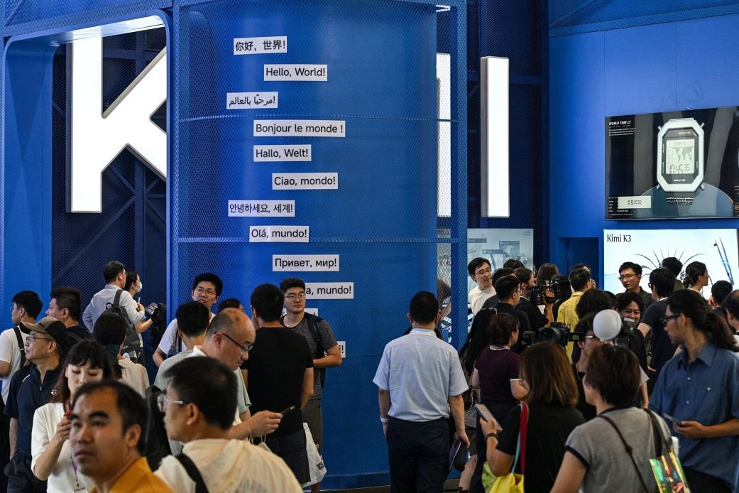 People visit the Moonshot AI stand, featuring the Kimi K3 model, during the World Artificial Intelligence Conference (WAIC) in Shanghai on July 18, 2026.