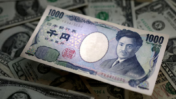 Japanese Yen Falls as Japan Vows Orderly Currency Moves After Fed Rate Hike