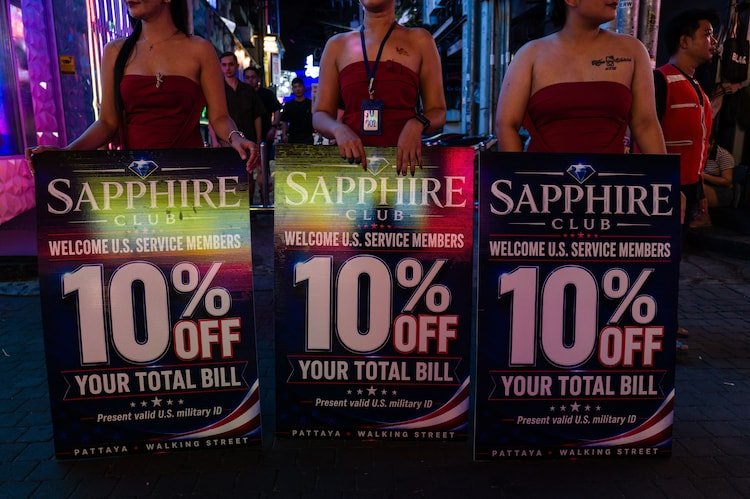 The Sapphire Club deployed three women in strapless black bodysuits to offer discounts to US military ID holders.